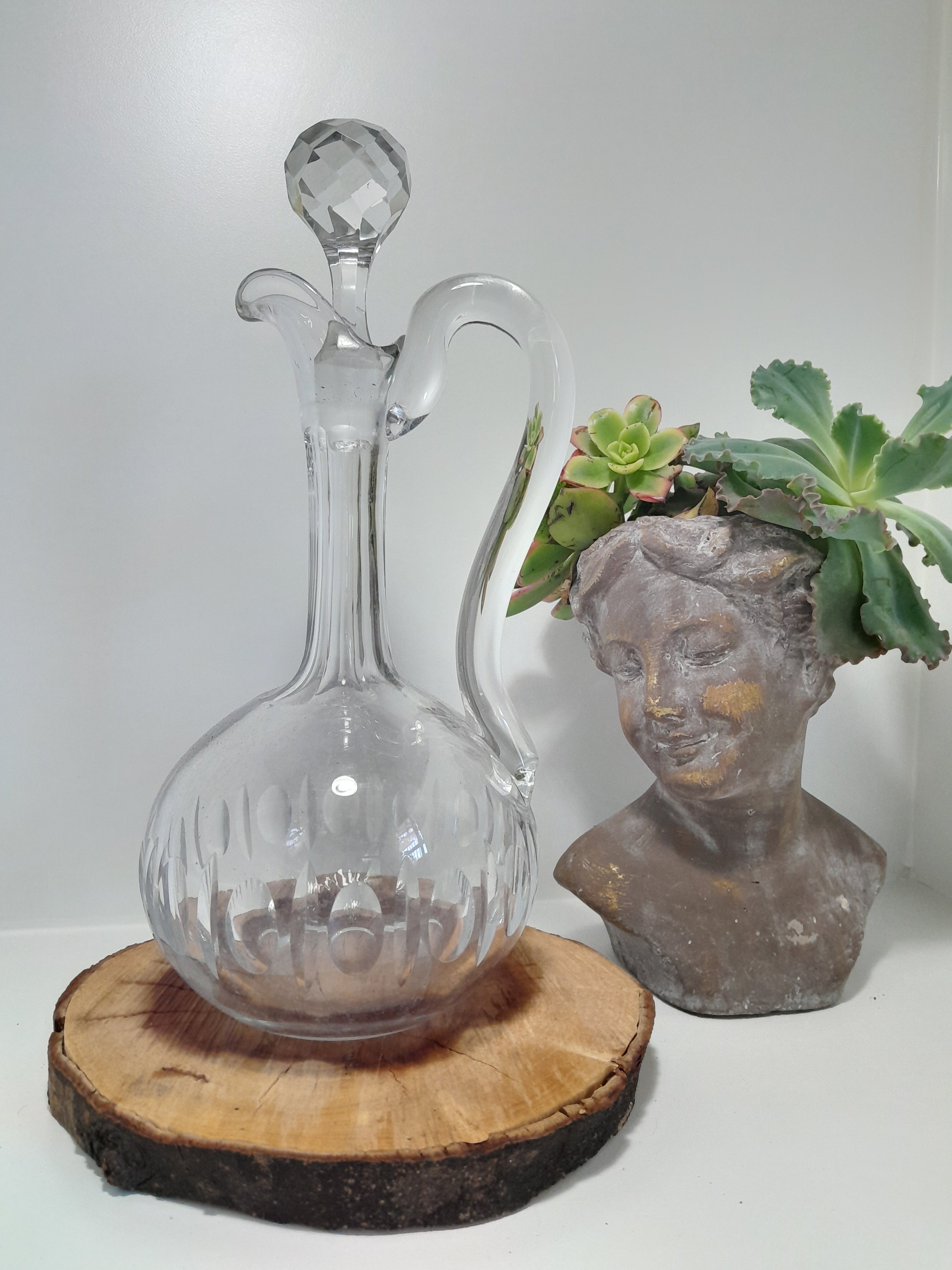 A Handled Crystal Decanter with Multifaceted Stopper