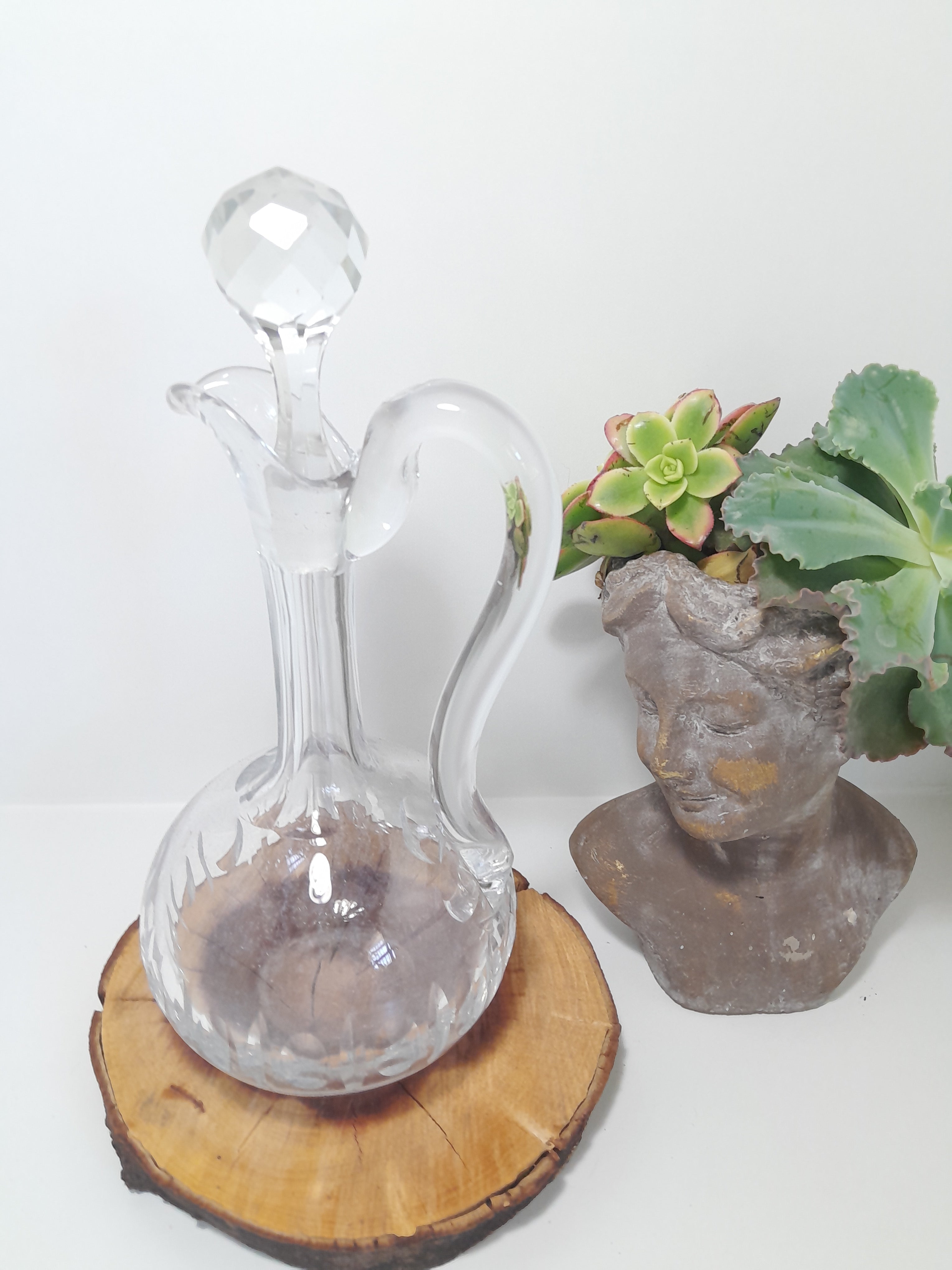 A Handled Crystal Decanter with Multifaceted Stopper