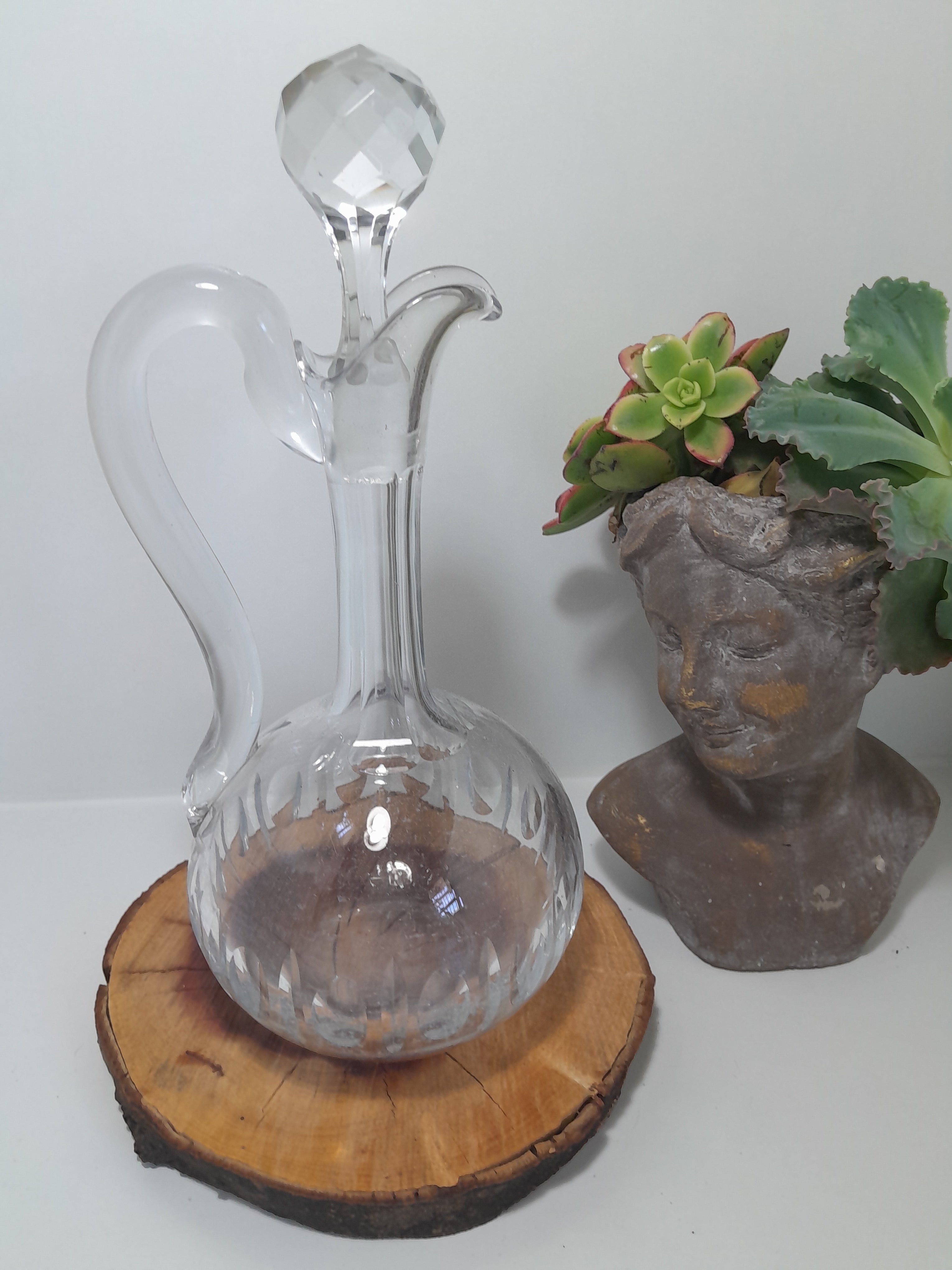 A Handled Crystal Decanter with Multifaceted Stopper