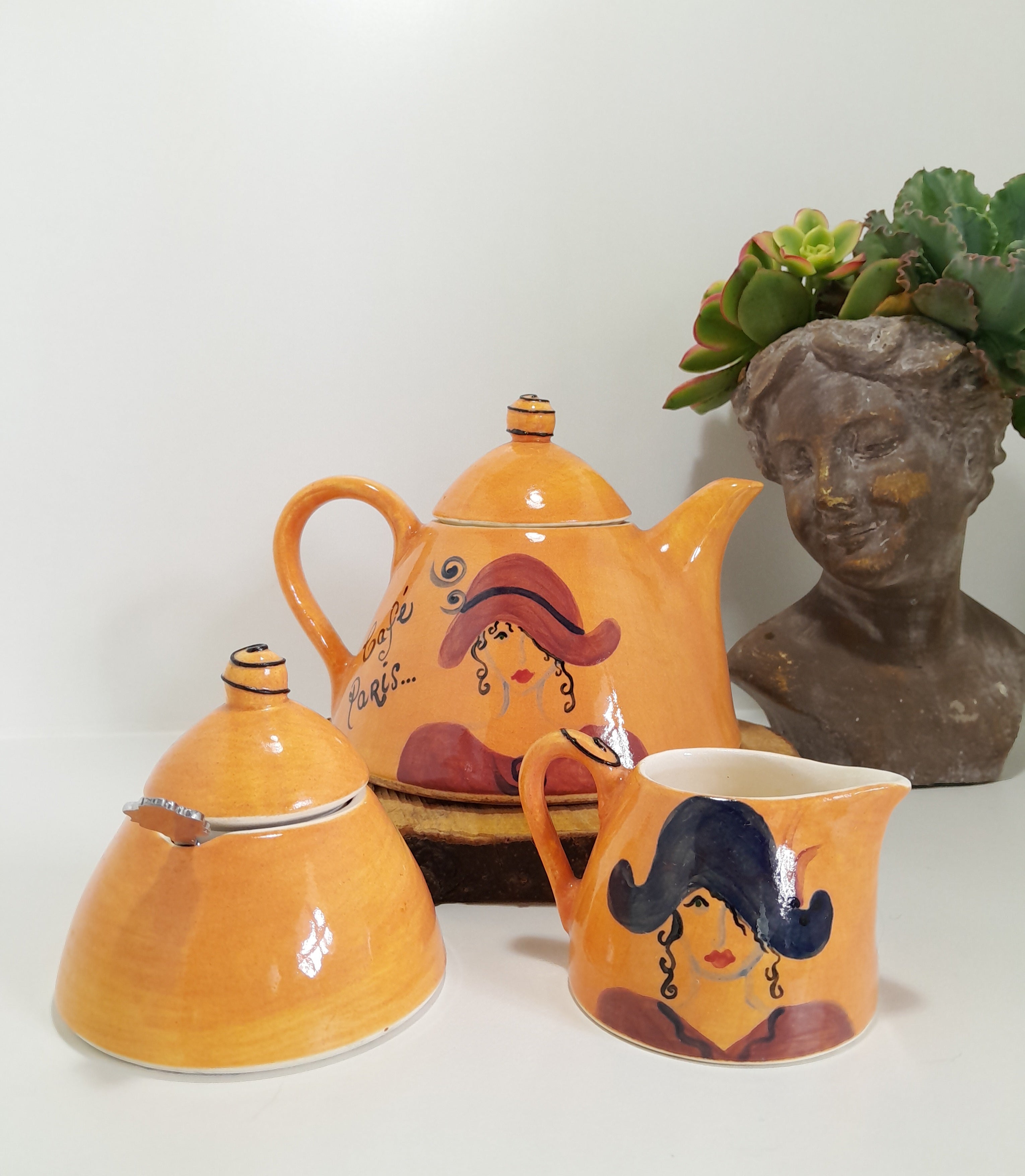 3 Piece Hand-painted Glazed Pottery Tea Set in a Vibrant Orange Colour with Black Trim on Finials and Including a Silver Coloured Sugar Spoon