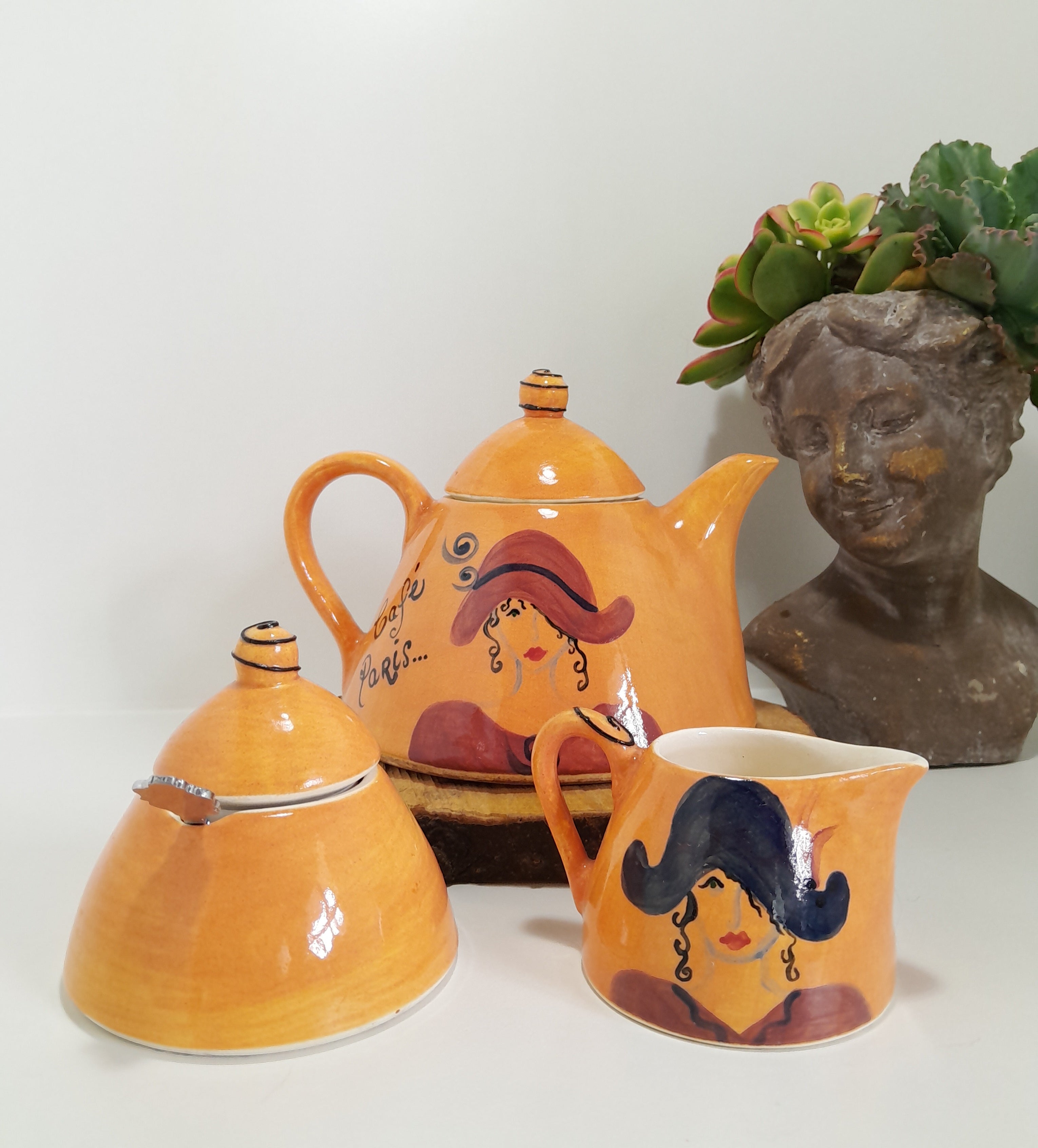 3 Piece Hand-painted Glazed Pottery Tea Set in a Vibrant Orange Colour with Black Trim on Finials and Including a Silver Coloured Sugar Spoon