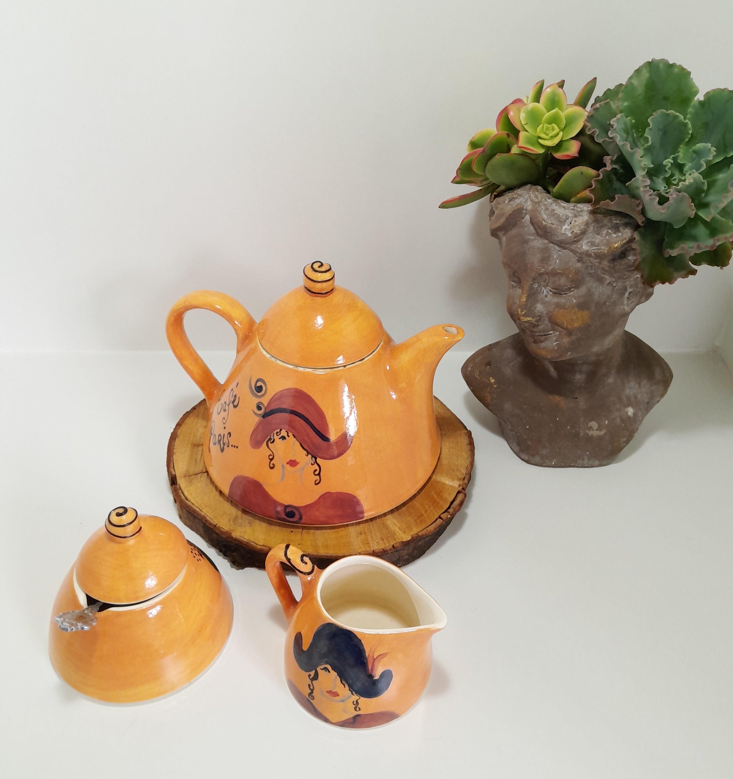 3 Piece Hand-painted Glazed Pottery Tea Set in a Vibrant Orange Colour with Black Trim on Finials and Including a Silver Coloured Sugar Spoon