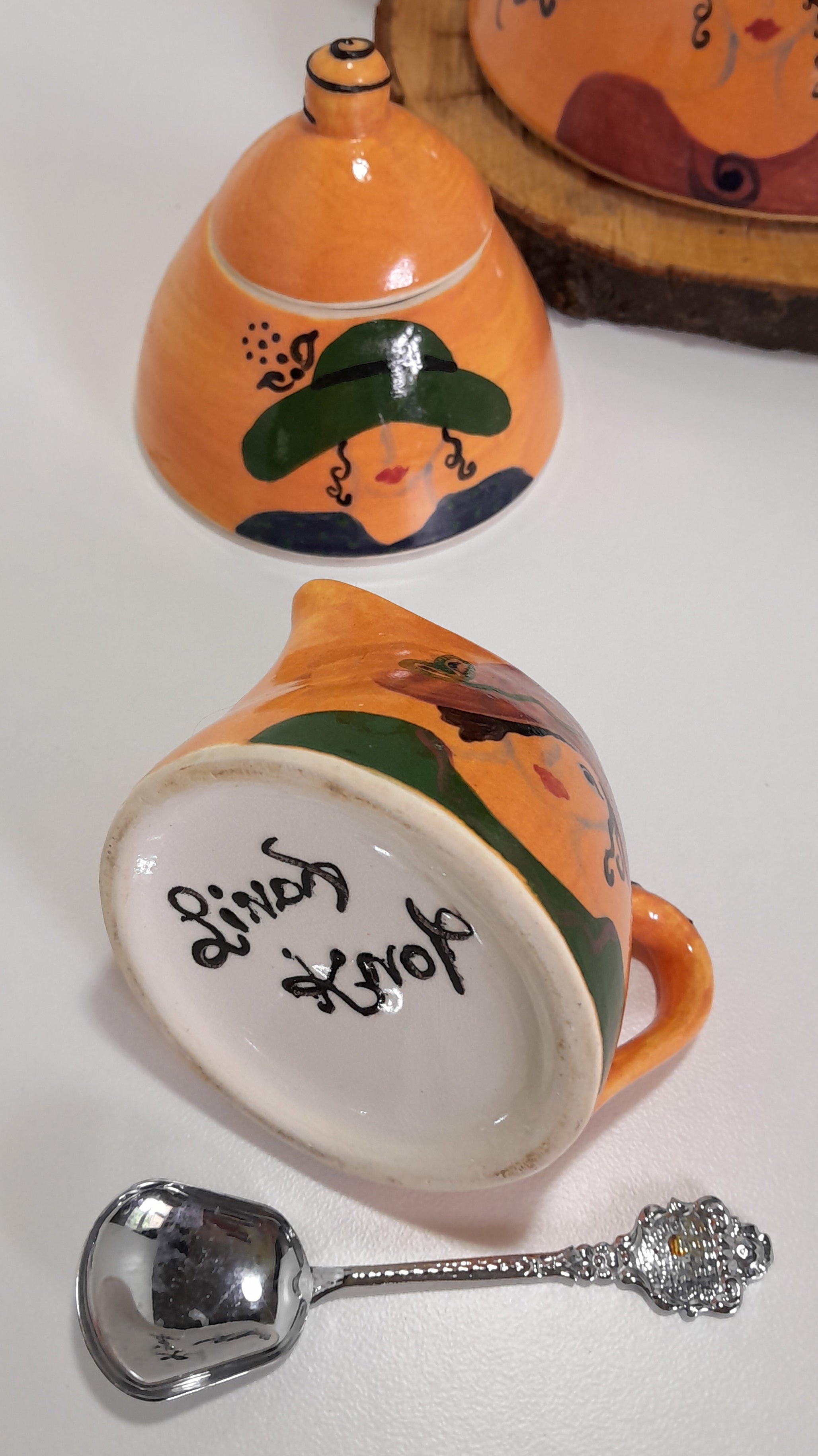 3 Piece Hand-painted Glazed Pottery Tea Set in a Vibrant Orange Colour with Black Trim on Finials and Including a Silver Coloured Sugar Spoon