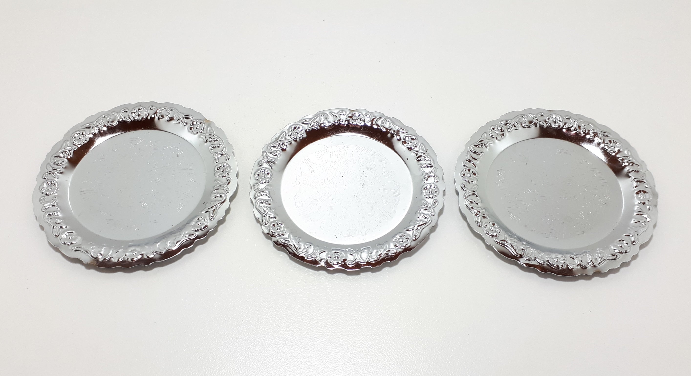 Three Decorative Silver Metal Coasters