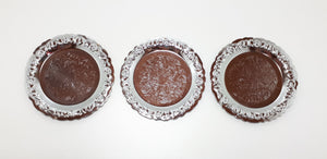 Three Decorative Silver Metal Coasters