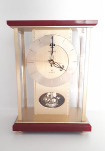 Vintage 1980’s Japanese Rhythm Quartz Mantel Clock – Brass, Maroon Bakelite, Glass & Perspex With Wheel Motion