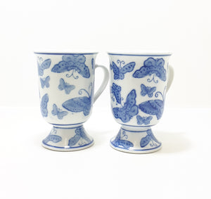 Pair Of Blue & White Footed Coffee Mugs With Butterfly Decoration