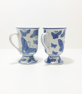 Pair Of Blue & White Footed Coffee Mugs With Butterfly Decoration