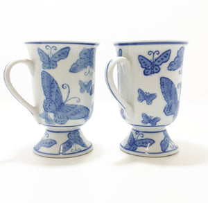 Pair Of Blue & White Footed Coffee Mugs With Butterfly Decoration
