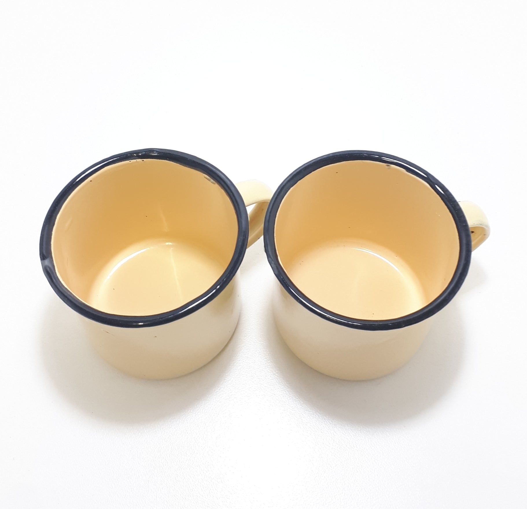 Pair Of Yellow Vintage Enamel Mugs With Broad Black Rim