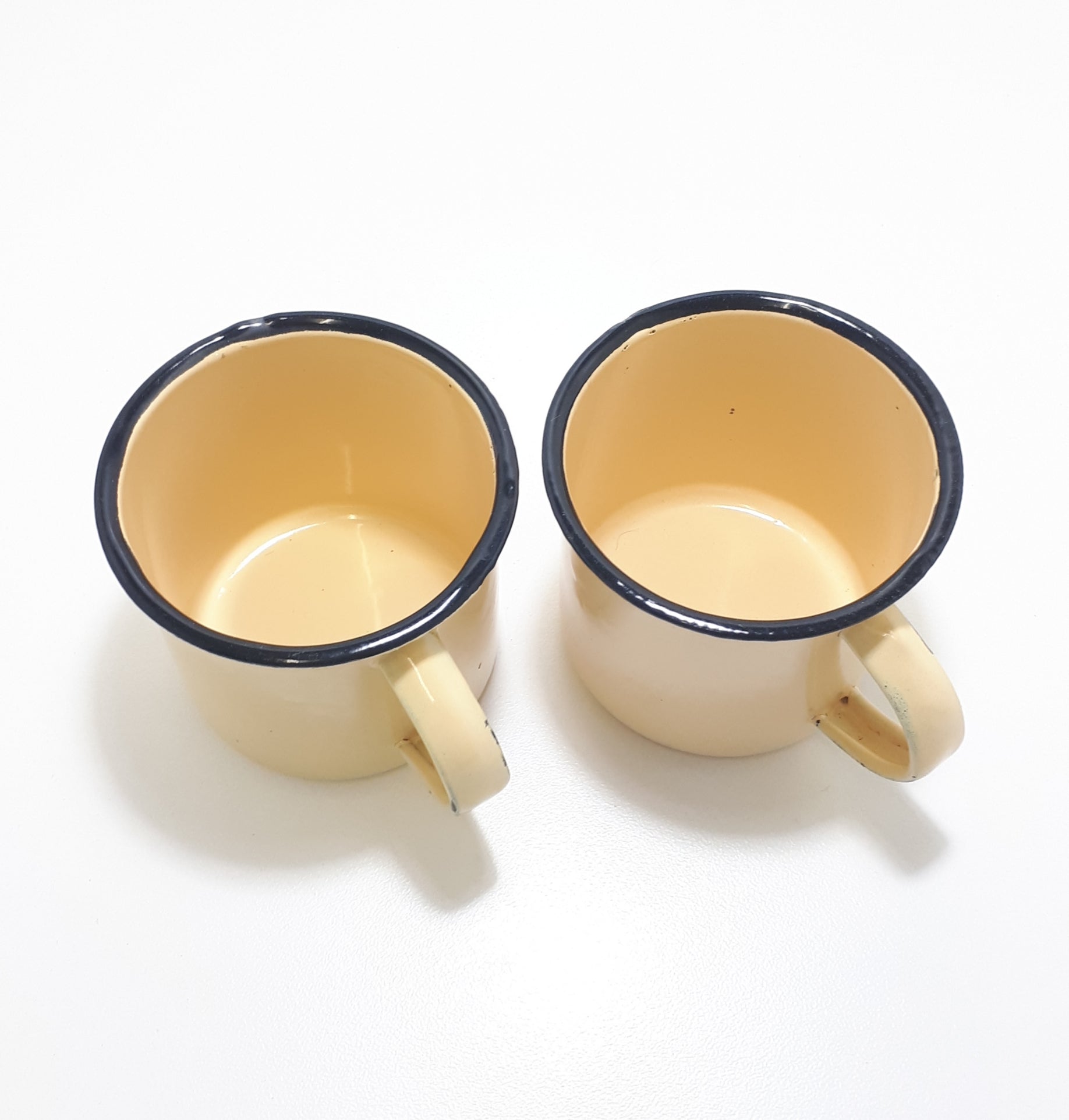 Pair Of Yellow Vintage Enamel Mugs With Broad Black Rim