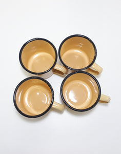 Set Of Four Yellow Vintage Enamel Mugs With Broad Black Rim